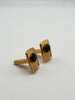 Angled view of vintage green cabochon cufflinks showing gold-tone swivel-back closures