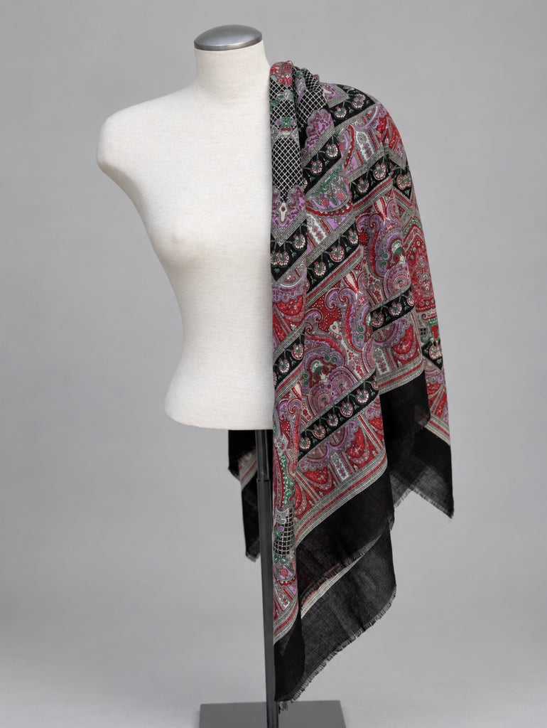 Vintage multicolour paisley scarf styled over shoulders on white mannequin