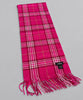 Long pink plaid cashmere scarf laid flat showing fringed ends