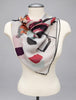 Colourful Aker Sport floral scarf tied around mannequin neck