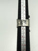 Vintage 925 sterling silver ring photographed beside ring sizing mandrel