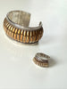 Vintage sterling silver cuff and ring set showing dimensional ribbed design and gold-tone accents