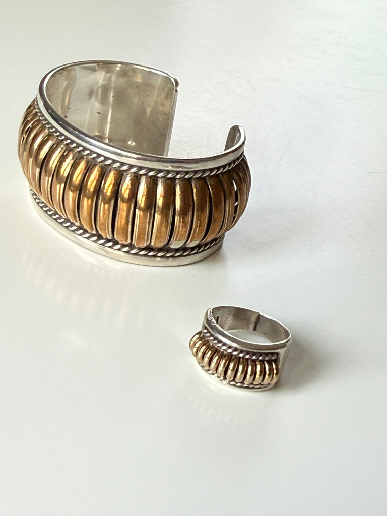 Vintage sterling silver cuff and ring set showing dimensional ribbed design and gold-tone accents