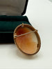 Back of vintage shell cameo showing pin closure and pendant bail