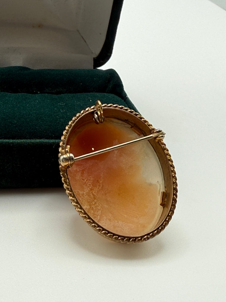 Back of vintage shell cameo showing pin closure and pendant bail