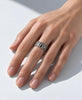 Sculptural Canadian modernist silver ring worn on hand showing bold statement style