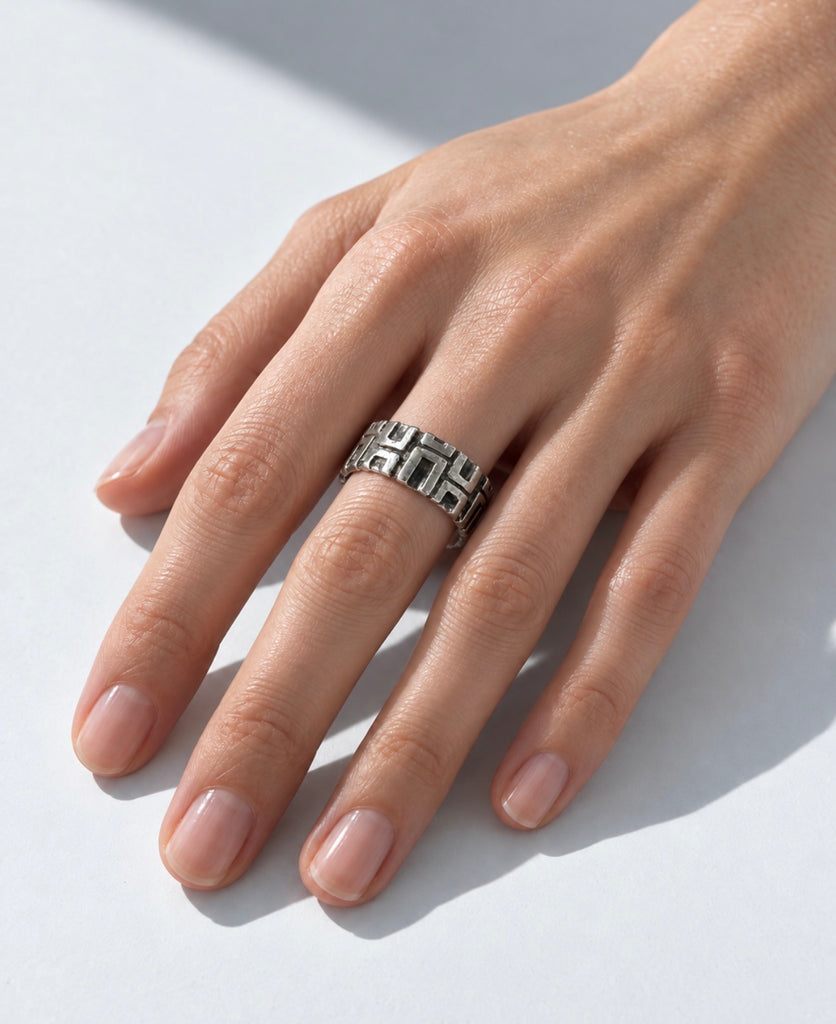Sculptural Canadian modernist silver ring worn on hand showing bold statement style