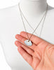 Vintage sterling silver agate pendant necklace held in hand showing reverse 