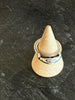 Vintage silver Fede ring displayed on ring cone showing clasped hands design