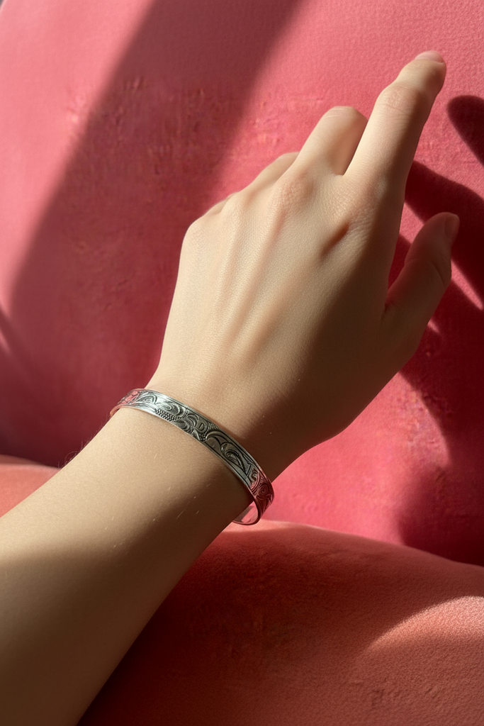 Vintage Eagle and Raven silver bracelet worn on wrist