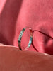 Side view of engraved Northwest Coast silver bracelet worn on wrist