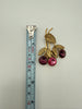 Vintage Austrian crystal brooch beside measuring tape showing approximately 3 inch length