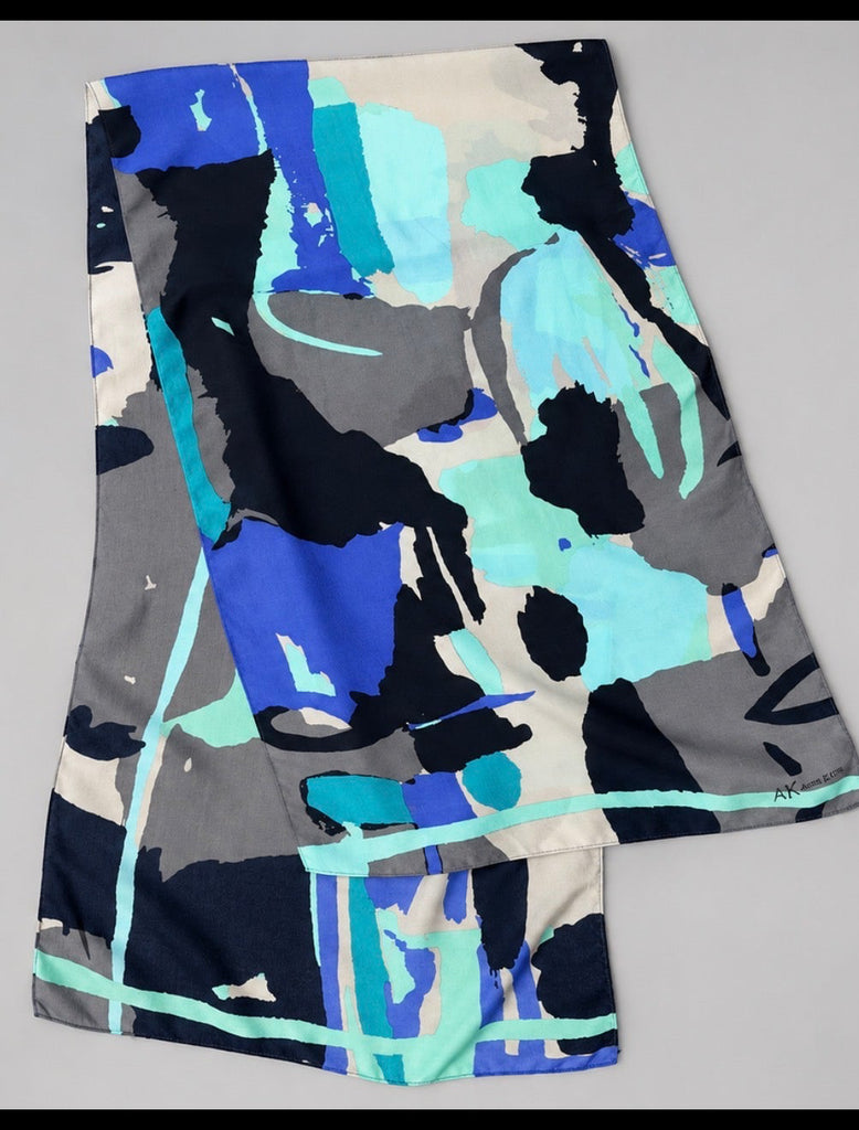 Colourful Anne Klein silk scarf showing bold abstract print and flowing fabric