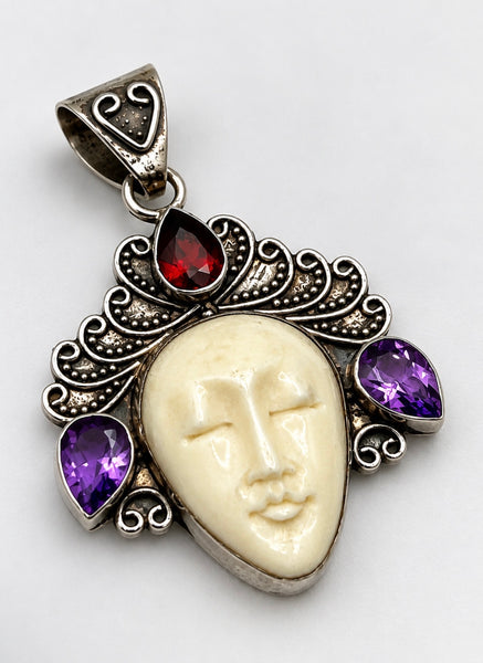Vintage Balinese goddess sterling silver pendant with carved cream face, purple amethysts and red garnet