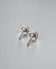 Back of vintage silver stud earrings showing posts and butterfly backs
