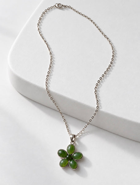 Sterling silver green jade five-petal flower pendant necklace displayed on white background