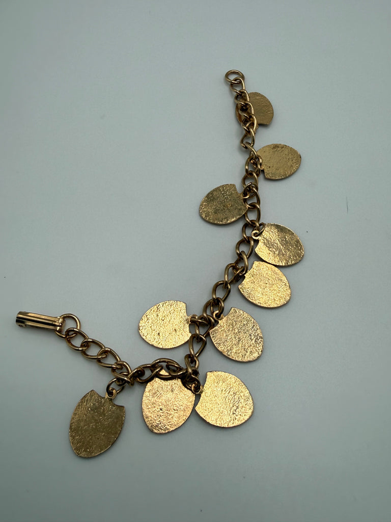 Back view of vintage Canadian provincial shield charm bracelet showing gold-tone metal