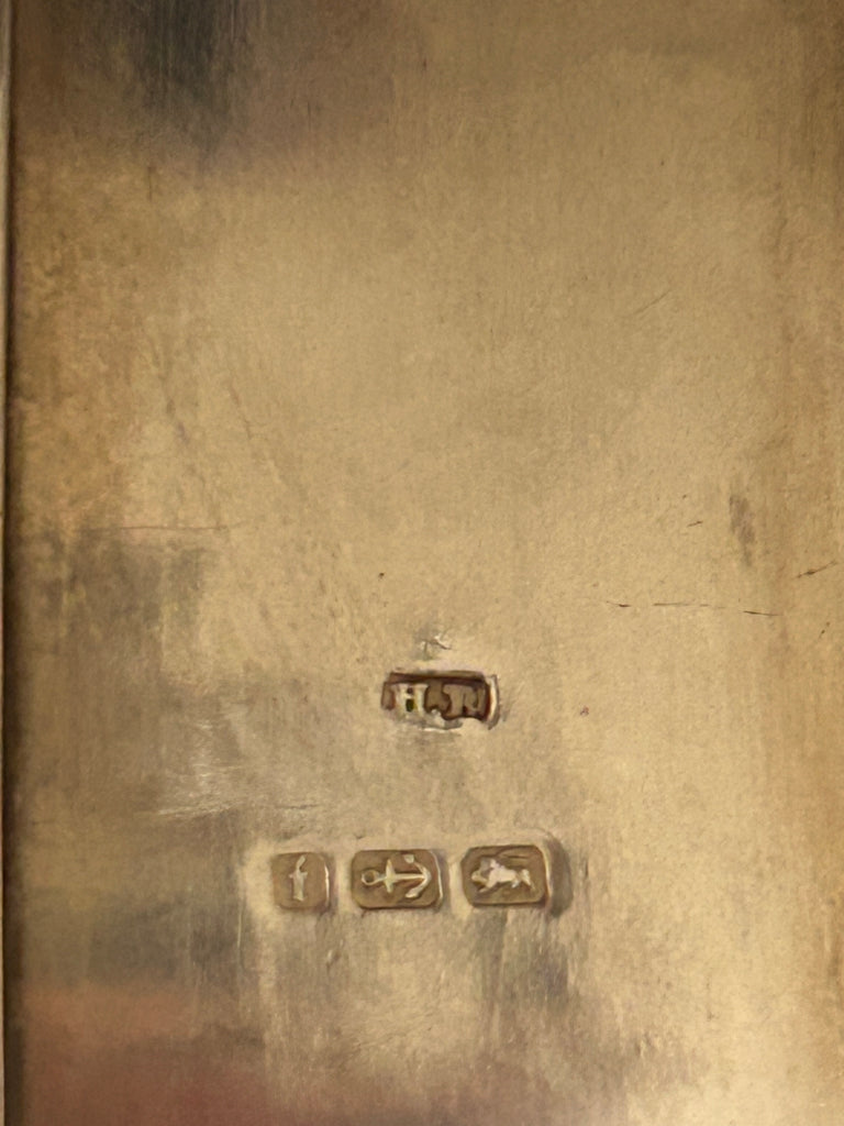 Close-up of Henry Matthews Birmingham sterling silver hallmarks dating to 1905
