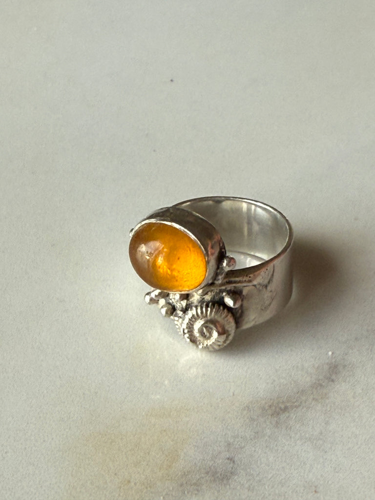 Vintage cognac Baltic amber ring with sculptural sterling silver ammonite design