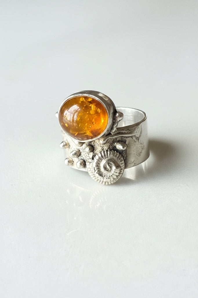 Side view of vintage Baltic amber sterling silver Brutalist ring showing sculptural silverwork