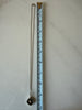 Vintage Finnish pendant necklace beside measuring tape showing chain length