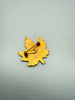 Back of vintage Canadian maple leaf brooch showing pin closure and engraved 1970 date