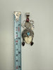 Vintage Queen of Hearts goddess pendant beside measuring tape showing approximately 2.5 inch length