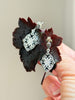 Vintage Art Deco style silver dangle earrings with black and clear decorative stones