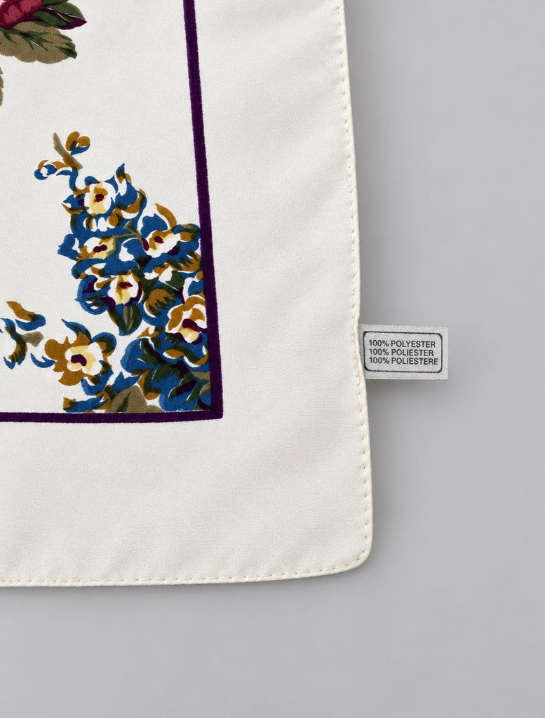 Vintage Italian floral square scarf showing polyester tag, cream border and colourful botanical design