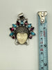 Vintage Balinese Moon Goddess silver pendant beside measuring tape showing pendant length