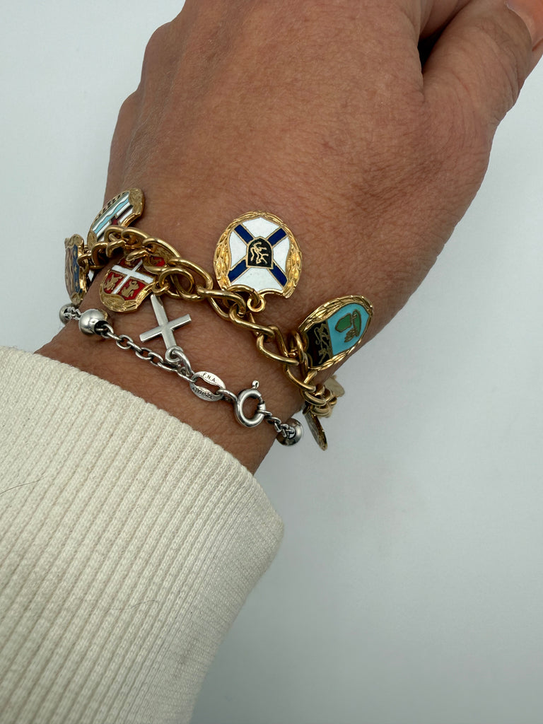 Colourful Canadian enamel provincial shield charm bracelet shown worn for scale