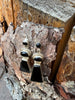 Black onyx and sterling silver dangle earrings photographed on natural wood
