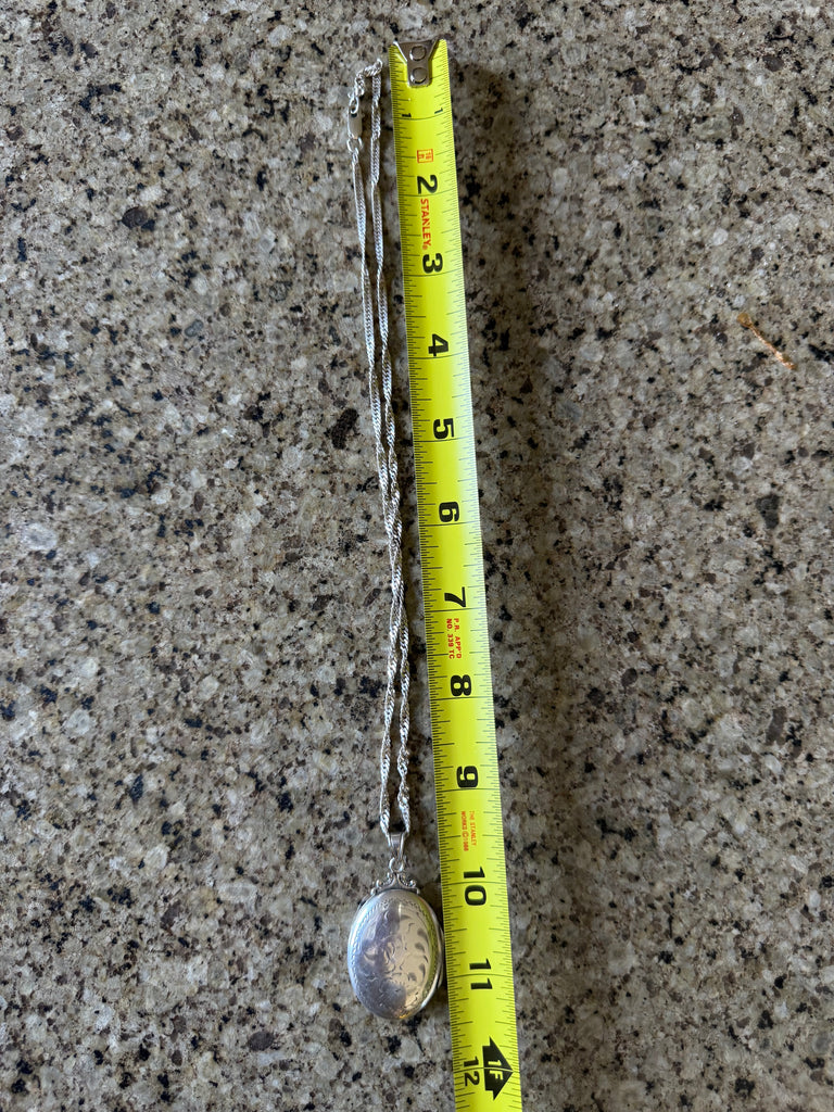 Yellow measuring tape on a textured concrete surface