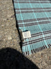 Close-up of blue teal grey plaid pattern on vintage Valbisenzio scarf