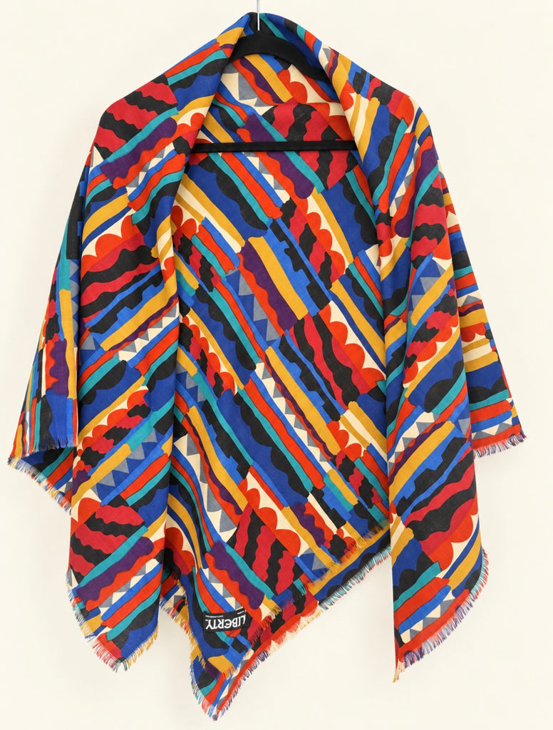 Vintage Liberty Bauhaus wool scarf showing colourful geometric pattern and fringed edges