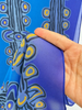 Close-up of Lily Nungarrayi Hargraves scarf showing blue yellow purple and black abstract design. 