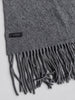 Close-up of vintage cashmere scarf showing textured weave and fringe
