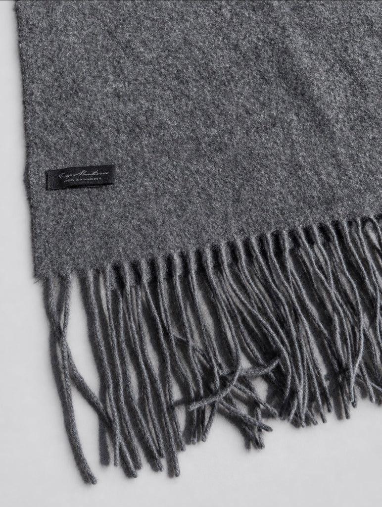 Close-up of vintage cashmere scarf showing textured weave and fringe