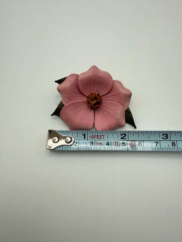 Alberta Wild Rose leather brooch beside measuring tape showing approximately 2.25 inch width