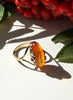Vintage Polish Baltic amber ring in gold-plated sterling silver with cognac-orange amber cabochon among red berries