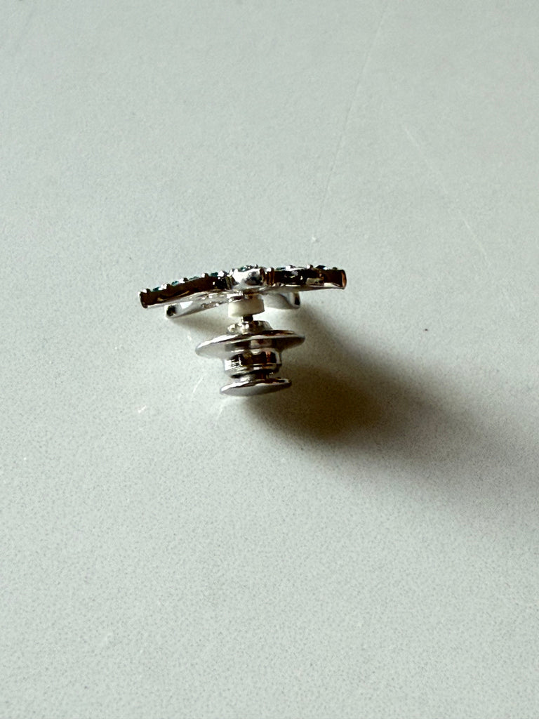Back of Swarovski Eternity starfish pin showing metal setting and pin closure