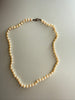 Full view of vintage cream freshwater pearl strand necklace
