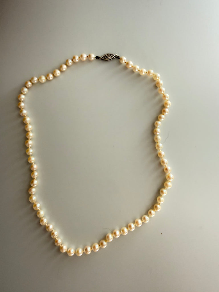 Full view of vintage cream freshwater pearl strand necklace
