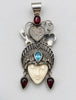 Vintage Queen of Hearts goddess sterling silver pendant with carved bone face, blue topaz and red garnet accents