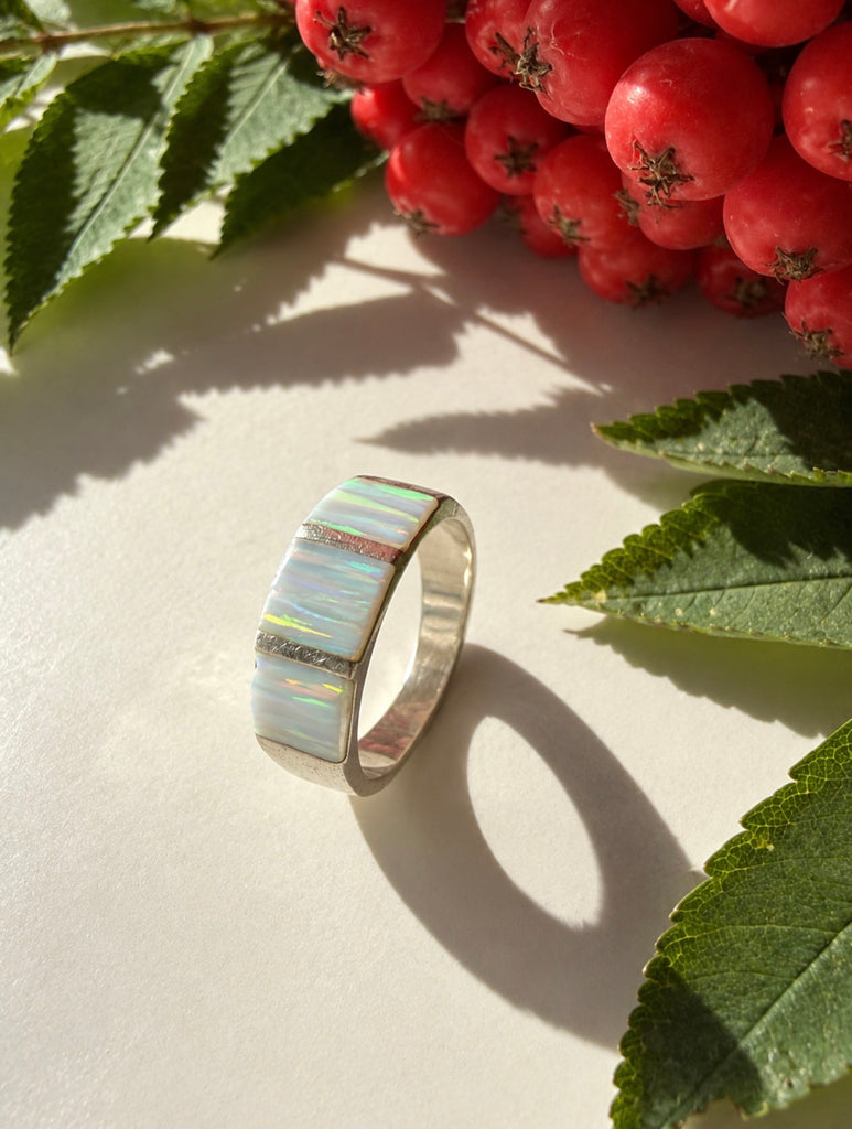 Side view of sterling silver opal wide band ring