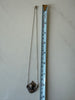 Sterling silver maiden pendant necklace photographed beside measuring tape