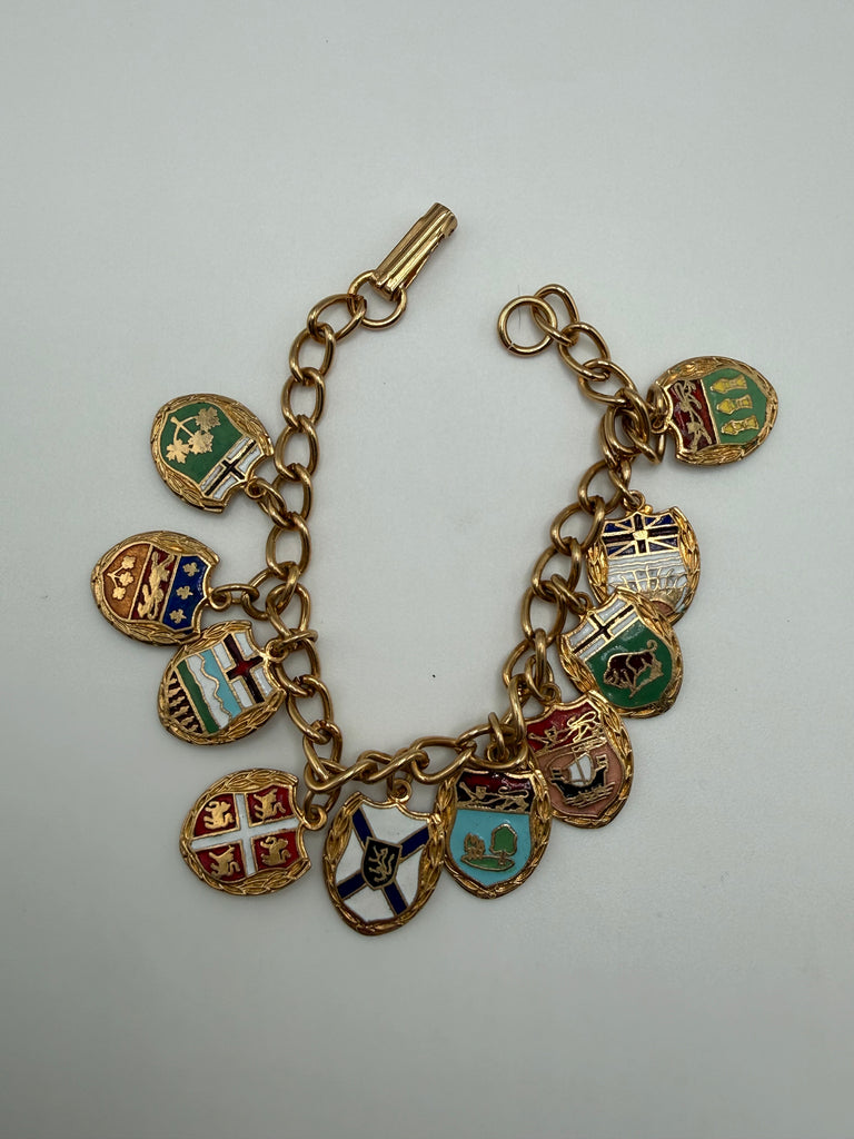Vintage Canada souvenir bracelet with dangling multicoloured provincial shield charms