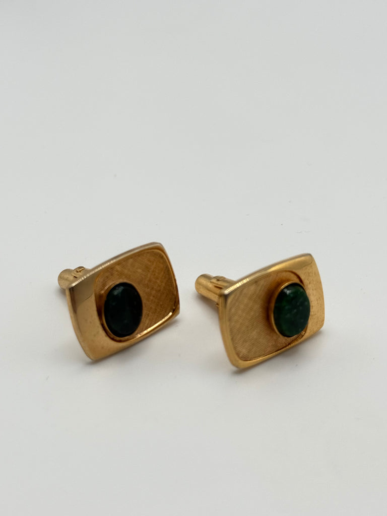 Vintage gold-tone cufflinks with oval green cabochons and textured geometric settings