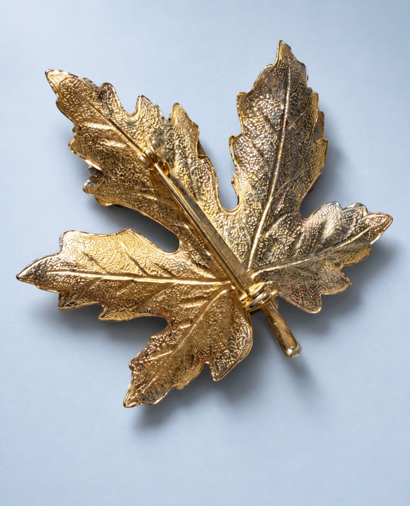 Back view of vintage gold-tone Montreal maple leaf souvenir brooch