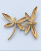 Back of gold-tone dragonfly brooch showing pin closure